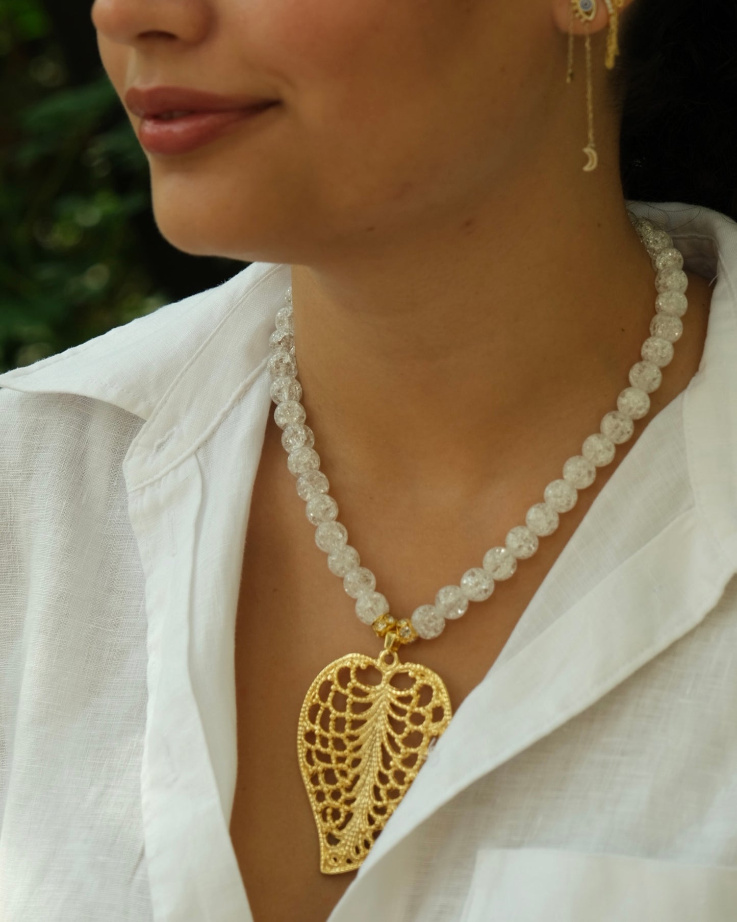 Gold leaf pendant with white beaded necklace